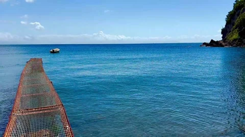 A small pier for boats extends not far into the sea. Italy. Stock Footage 310357922