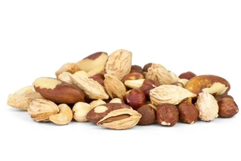 Small pile of different nuts isolated on the white background Foto stock
