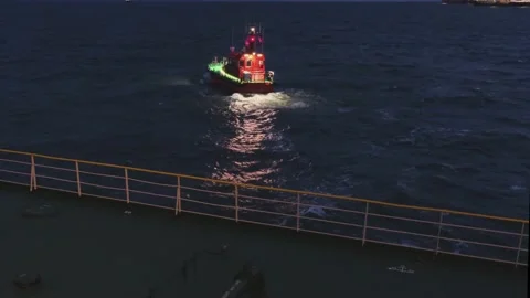 Small pilot boat departs from large Natig Alliev tanker 動画素材 130994524