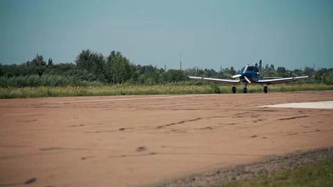 Small plane aircraft is moving on on the runway. Airfield of flying club Stock Footage 101062898