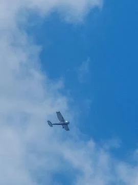 Small Plane in the Blue Sky Stock Photos