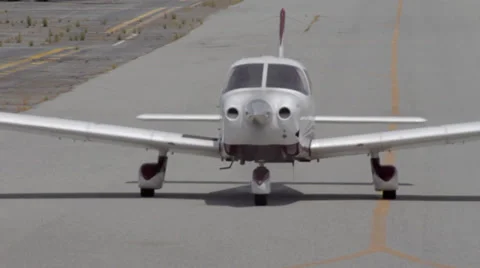 Small Plane Coming Down Runway at Camera Stock Footage 39818999