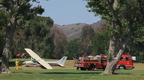 SMALL PLANE CRASHES ON GOLF COURSE Stock Footage 22952483