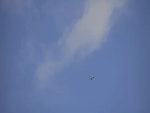 Small Plane crossing the blue sky Stock Footage
