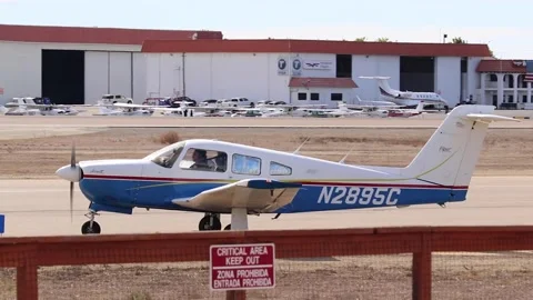 Small plane driving on runway Stock Footage 221378113
