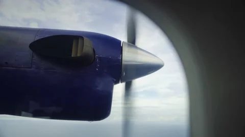 Small plane engine and propeller from window of small plane Stock Footage 168777024