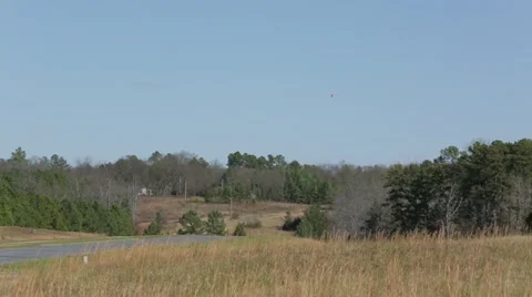 Small plane flies from sky Stock Footage 22100446