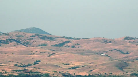 Small plane flight dusting over Afganistan, Syria hills Stock Footage 57113125