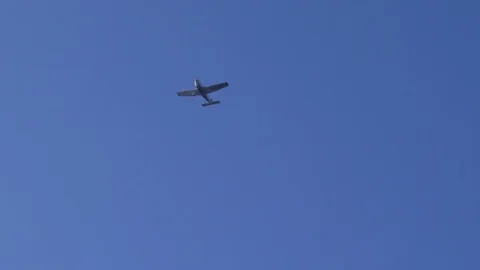 Small Plane Flying in the Blue Sky Stock Footage 87197442