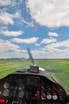Small plane landing Stock Photos