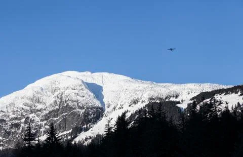 Small plane over Mt. Ripinsky Stock Photos