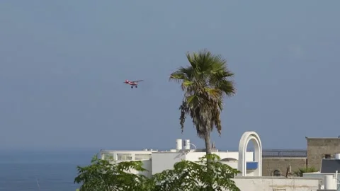Small Plane Over Oceanview Town Stock Footage 156865808