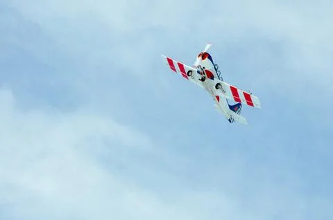 Small plane with propeller on blue sky Stock Photos