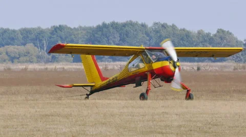 Small plane on  soil field. Stockbeeldmateriaal 56135182