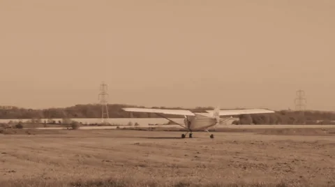 Small plane takes off sepia Stock Footage 42493881