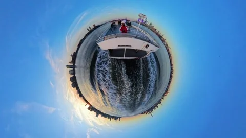 Small Planet effect of ferry boat on frozen Hudson River at sunset, New York 動画素材 310347538