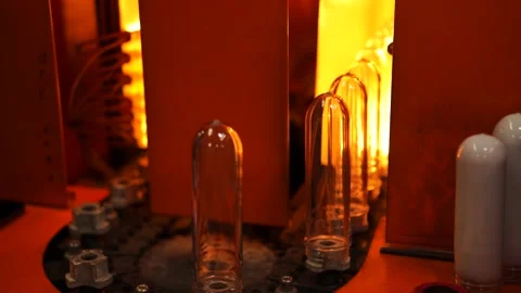 Small plastic blanks from underwater bottles travel along a conveyor belt Stock Footage 161988068