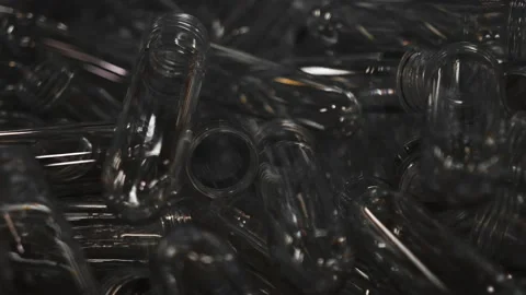 Small plastic blanks from underwater bottles travel along a conveyor belt Stock Footage 161988442