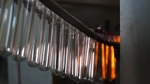 Small plastic blanks from underwater bottles travel along a conveyor belt Stock Footage 161988611