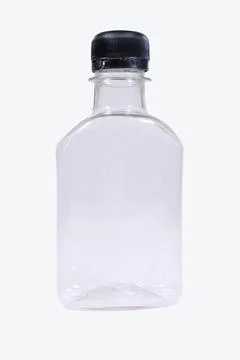 Small plastic bottle with black cap isolated on white background Stock Photos