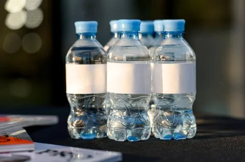 Small plastic bottles with clean drinking water Stock Photos