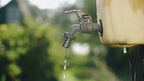 A small plastic canister with water Stock Footage 158861823