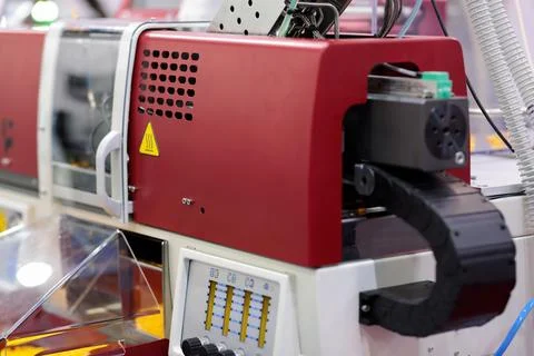 Small plastic injection molding machine closeup Stock Photos