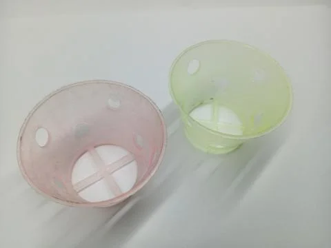 Small plastic net pots for hydroponics on white background Stock Photos