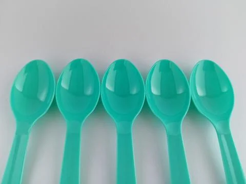 Small plastic spoons Stock Photos