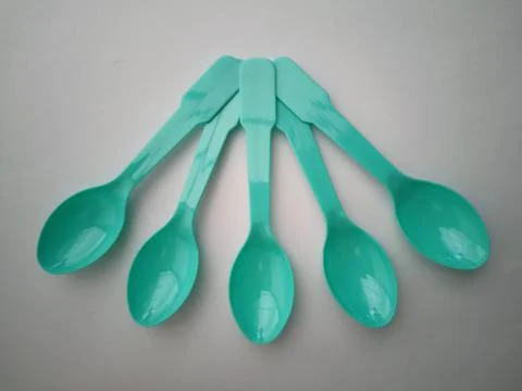 Small plastic spoons Stock Photos