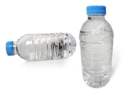 Small plastic water bottle with water drops. isolated on a white background Stock-Fotos