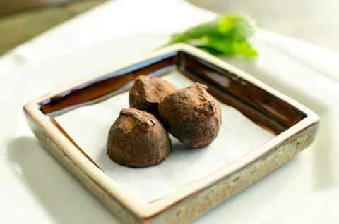 Small plate of chocolate truffles. Stock Photos