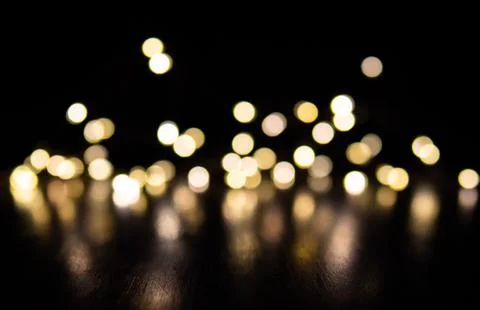 Small points of lights on a black background Stock Photos
