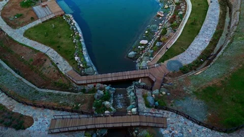 A small pond surrounded by rocks and rocks Stock Footage 273011839