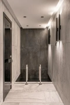 Small pool inside modern interior with luminous lamps 스톡 사진