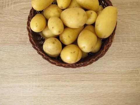 Small potatoes in a basket Stock Photos