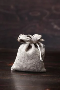 Small pouch on old table Fotos de archivo