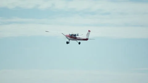 Small private airplane Cessna 152 taking off from small airfield into Stock Footage 140800802