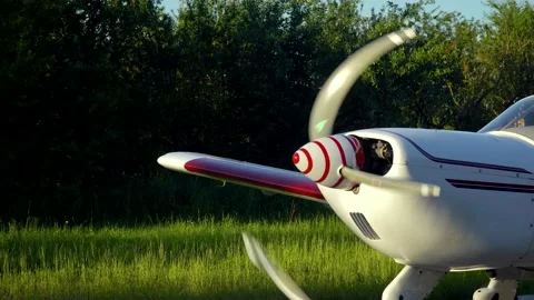 Small private airplane with spinning propeller stand on landing strip of airport Stock Footage 136593456