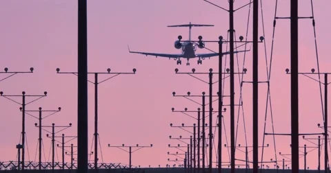 Small private business airplane jet plane landing in airport at sunset. 4K. Stock Footage 40673897