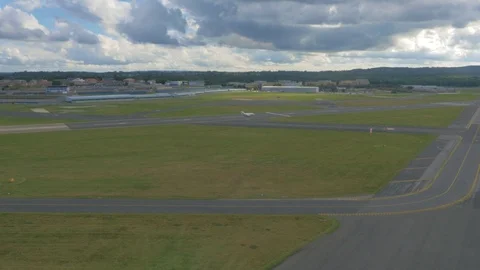 Small private jet taking off from large airport, drone aerial 4K Video stock 101109140