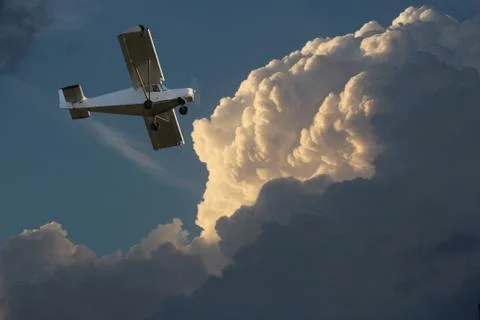 Small private  plane against the dramatic sky Stock Photos