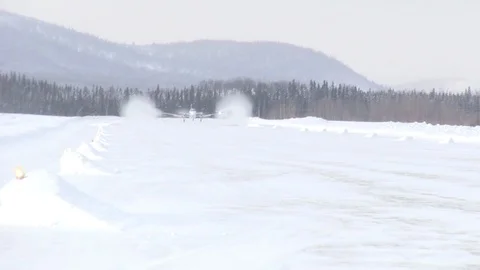 Small Private Plane Lands On Remote Snowy Runway Video stock 102134337