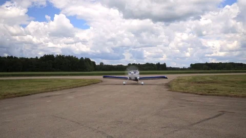 Small private plane preparing to take off from the airport runway Stock Footage 119398157