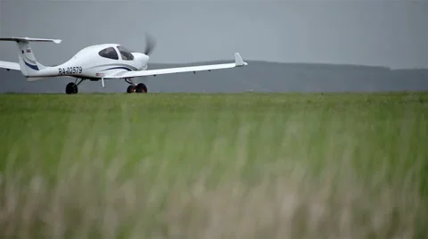 Small private planes on green field Stock Footage 65286799