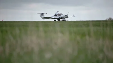 Small private planes on green field Stock Footage 65286808