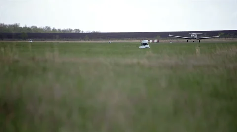 Small private planes on green field Stock Footage 65286827