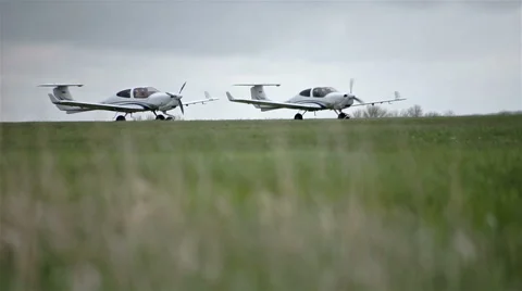Small private planes on green field Stock Footage 65286836