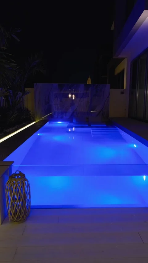 A small private swimming pool in the backyard of a luxury villa in Dubai on a Stock Footage 308352699