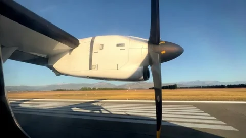 Small propeller aircraft ascending into the sky from the airport runway Stock Footage 270190144